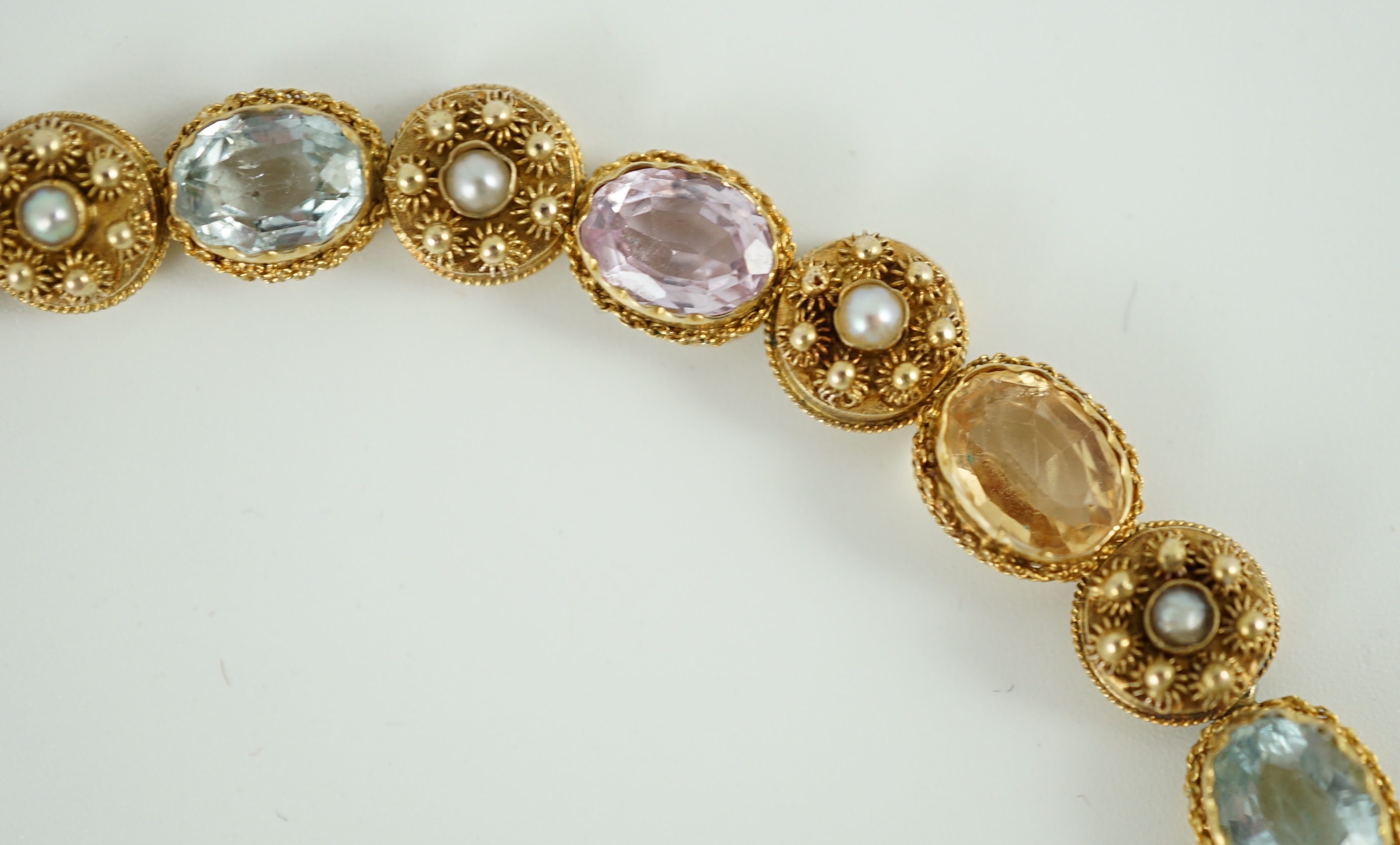 A 19th century gold, pink topaz, seed pearl, citrine and aquamarine set choker necklace